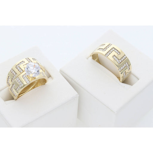 Close-up of maze pattern carving detail on 10K gold wedding ring with cubic zirconia stones