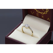 A three-quarter view of the fine jewelry diamond heart ring, highlighting the polished 1.7-gram 10K yellow gold band and the raised setting of the natural diamond heart cluster within the gold box