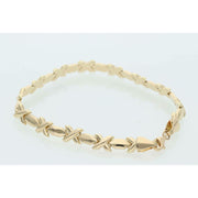 Professional product shot of a 7-inch yellow gold XOXO Hugs & Kisses bracelet on a clean white background