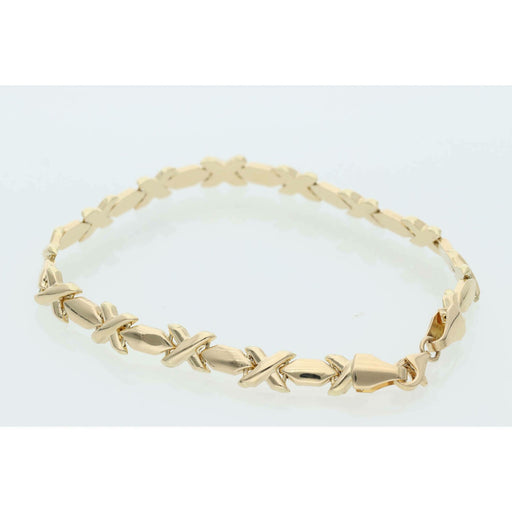 Professional product shot of a 7-inch yellow gold XOXO Hugs & Kisses bracelet on a clean white background