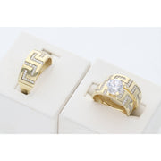 A 10 karat gold trio wedding ring with gemstone zirconium and maze carving, displayed in a white setting.