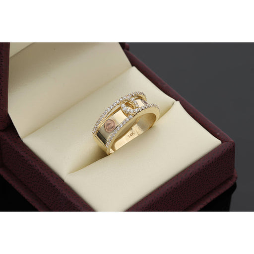 "14K yellow gold flat screw head ring with clear zircon stones - industrial chic band with two-tone finish by VEKA JEWELRY" Inside the stamp of 14K is seen. It is placed on a ring box of beige leather.