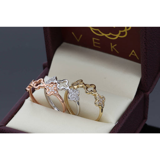 Elegant 14 Karat Gold Clover Cubic Zirconia Ring Set, featuring a trendy 20205 jewelry design with clear cubic zirconia stones in white, yellow, and rose gold, displayed each one in a luxurious box