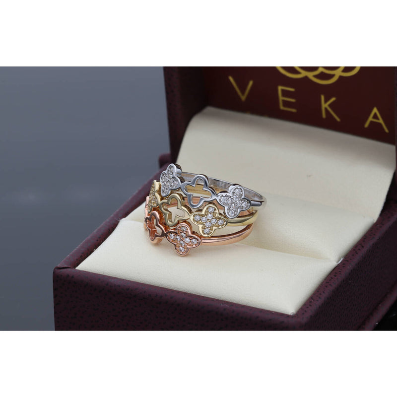 Elegant 14 Karat Gold Clover Cubic Zirconia Ring Set, featuring a trendy 20205 jewelry design with clear cubic zirconia stones in white, yellow, and rose gold, displayed on an elegant box.