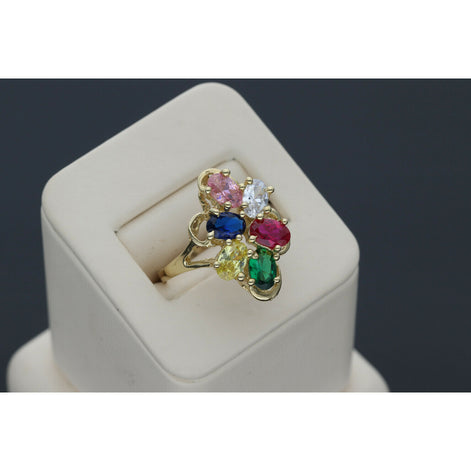 Graceful 14 karat Gold Multicolor Floral Ring 2025 Jewelry design with vibrant Sapphire accents, set on a beige ring holder in a gray backround.