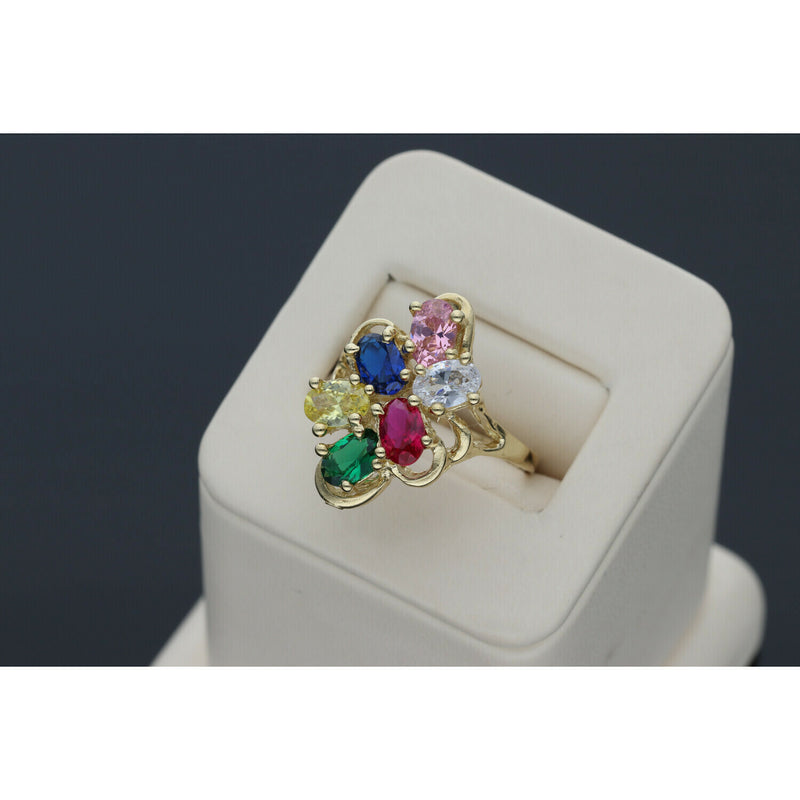 Graceful 14 karat Gold Multicolor Floral Ring 2025 Jewelry design with vibrant Sapphire accents, set on a beige ring holder in a gray backround.