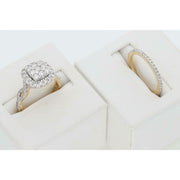 14K Yellow Gold bridal set with 1.5 CTW natural diamonds presented in white jewelry display boxes.
