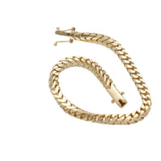 Macro close-up of the secure box lock clasp engraved with 14K hallmark on a 5mm Franco chain bracelet