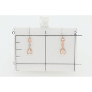 14 Karat Gold 0.15 ctw Diamond Arrow Stud Earrings  on a grid of 1" x 1" to serve as a size reference. Veka Jewelry