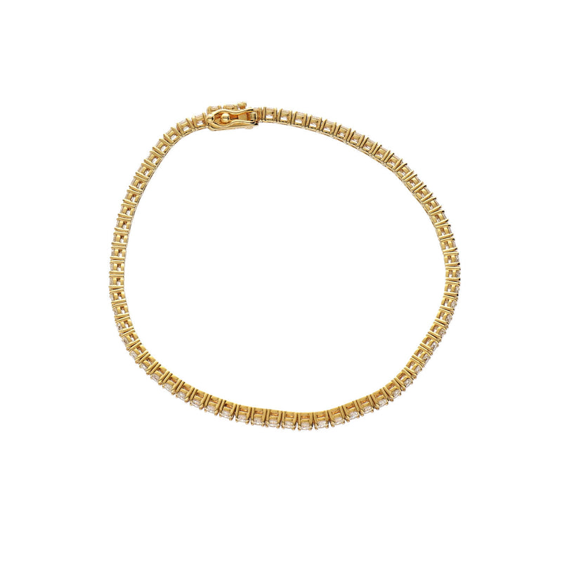Close-up of 67 natural diamonds set in a classic 14K yellow gold 4-prong tennis bracelet.