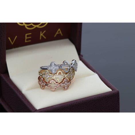 Elegant 14 Karat Gold Clover Cubic Zirconia Ring Set, featuring a trendy 20205 jewelry design with clear cubic zirconia stones in white, yellow, and rose gold, displayed in a luxurious box