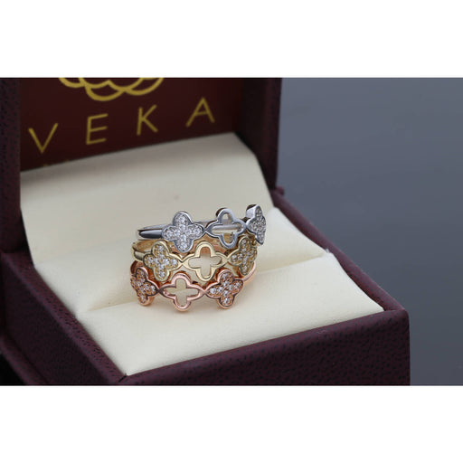Elegant 14 Karat Gold Clover Cubic Zirconia Ring Set, featuring a trendy 20205 jewelry design with clear cubic zirconia stones in white, yellow, and rose gold, displayed in a luxurious box
