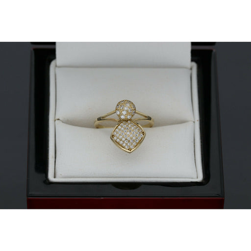 10K gold spinner ring with circle and heart charms featuring zirconium stones in white jewelry box"