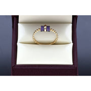 Close-up detail of 14K gold thin bead band ring showing purple zirconium stones and beaded texture - stackable jewelry by VEKA