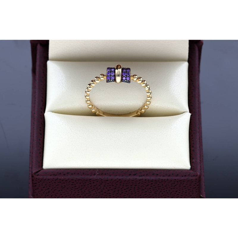 Close-up detail of 14K gold thin bead band ring showing purple zirconium stones and beaded texture - stackable jewelry by VEKA