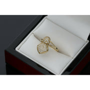 10K gold spinner ring with circle and heart charms featuring zirconium stones in white jewelry box"