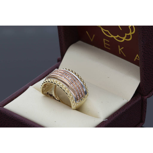 A 10 karat gold three-tone band ring with cubic zirconia stones set in yellow, white, and pink gold portions.