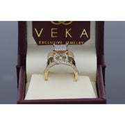 Close-up of an elegant 14K yellow gold anniversary ring with a high-polish finish and brilliant CZ stones