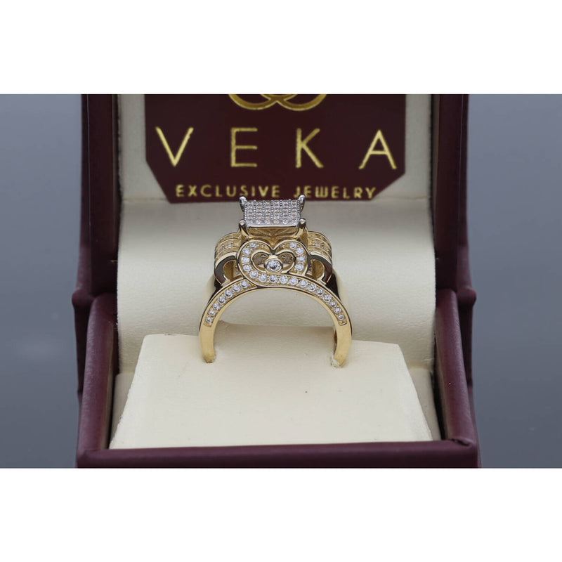 Close-up of an elegant 14K yellow gold anniversary ring with a high-polish finish and brilliant CZ stones