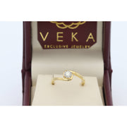 Side profile of a 14K yellow gold bypass fleur ring featuring 0.15 ctw natural diamonds
