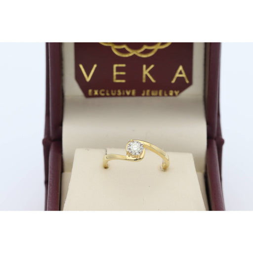 Side profile of a 14K yellow gold bypass fleur ring featuring 0.15 ctw natural diamonds