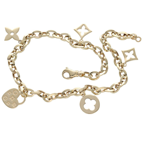 A 14 karat gold rolo chain anklet with various charms and embellishments. 5 elegant charms showing classic circular link chain design like the clover style and heart shaped one too!