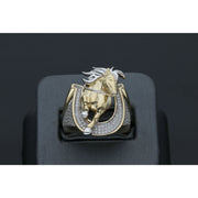 Detailed view of a men's heavy 14k yellow gold ring featuring a leaping horse with white gold accents set within a horseshoe paved with clear cubic zirconia stones in a black ring display