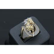 Detailed view of a men's heavy 14k yellow gold ring featuring a leaping horse with white gold accents set within a horseshoe paved with clear cubic zirconia stones on a black ring display