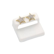 Close up of a pair 10K Gold Star Diamond Earrings 0.25ctw Star Design Natural Diamonds on a white background on a cushion stand.
