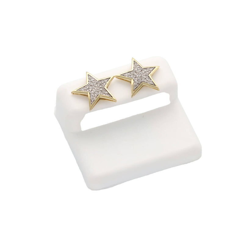 Close up of a pair 10K Gold Star Diamond Earrings 0.25ctw Star Design Natural Diamonds on a white background on a cushion stand.
