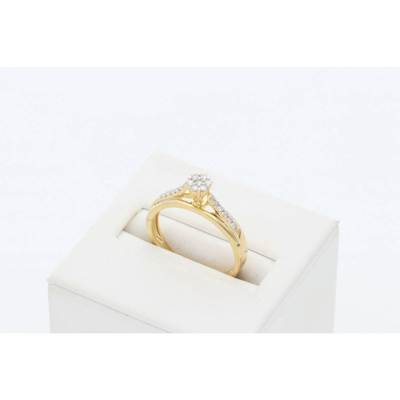 VEKA 14K yellow gold diamond cluster promise ring on white jewelry display stand