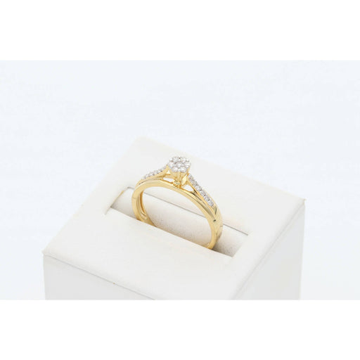 VEKA 14K yellow gold diamond cluster promise ring on white jewelry display stand