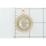 A clear verification shot showing the Veka Jewelry 14K Gold Virgen de Guadalupe Medallion Pendant positioned on a measurement grid, allowing customers to easily confirm the physical size and dimensions of the pendant