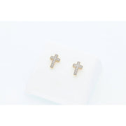 High-resolution studio shot of two 10 karat gold religious cross earrings with brilliant 0.10 CTW natural diamond accents on a clean white display cushion.